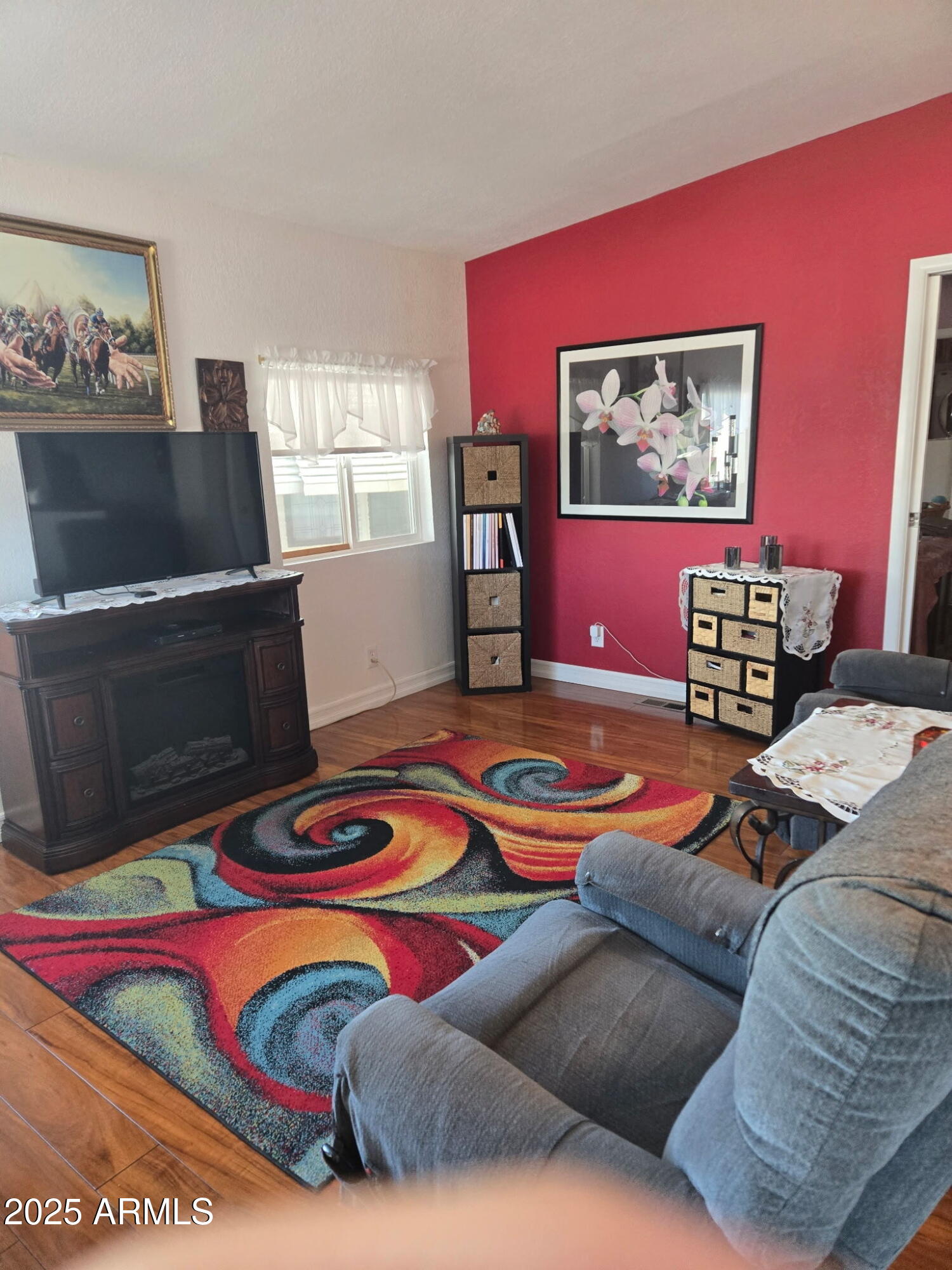 2209 West Klamath Avenue Apache Junction, AZ 85119 - Photo 6 of 30 a bedroom with furniture and a wooden floor