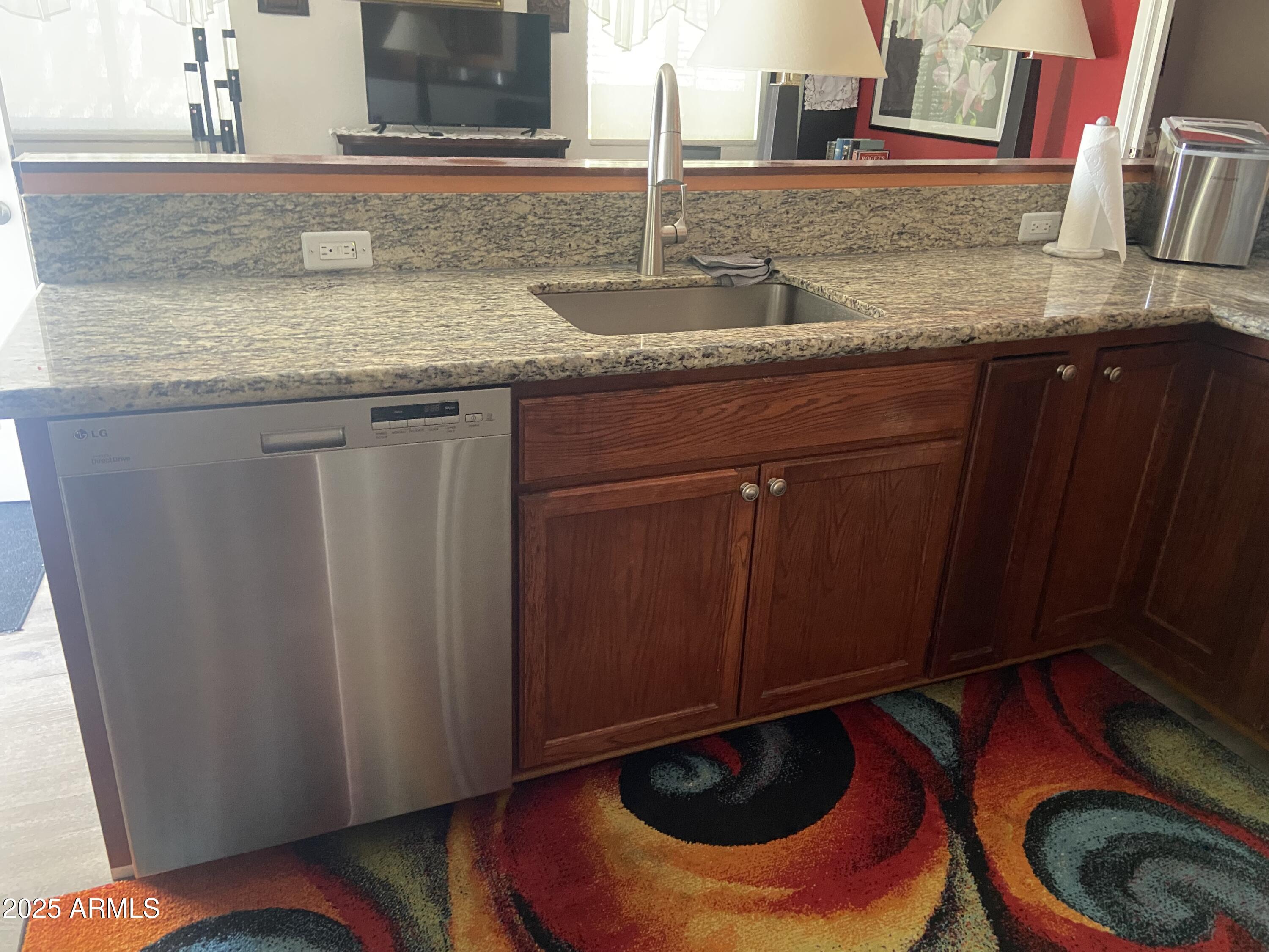 2209 West Klamath Avenue Apache Junction, AZ 85119 - Photo 7 of 30 a kitchen with a sink and a mirror