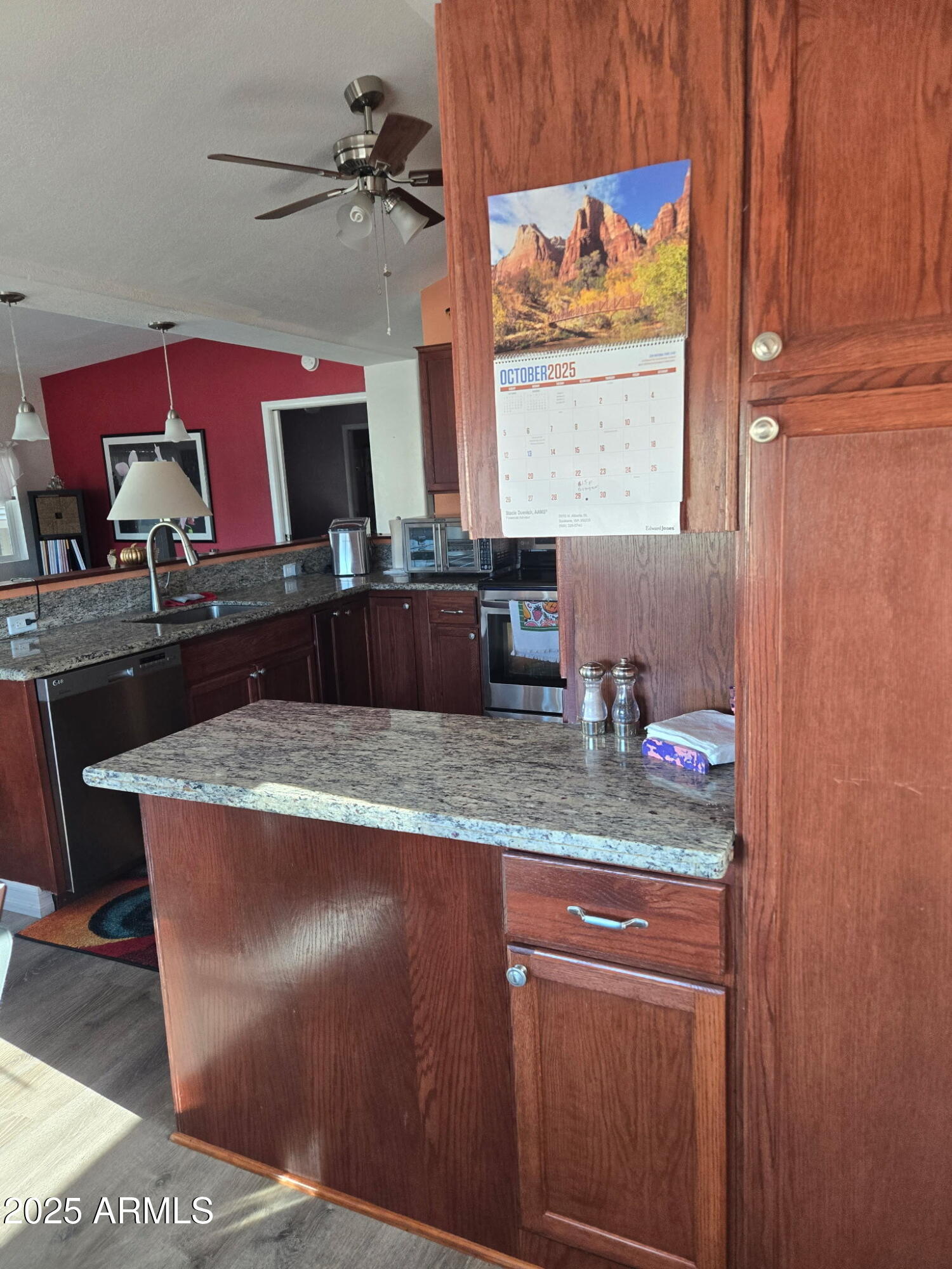 2209 West Klamath Avenue Apache Junction, AZ 85119 - Photo 10 of 30 a kitchen with a sink and a mirror