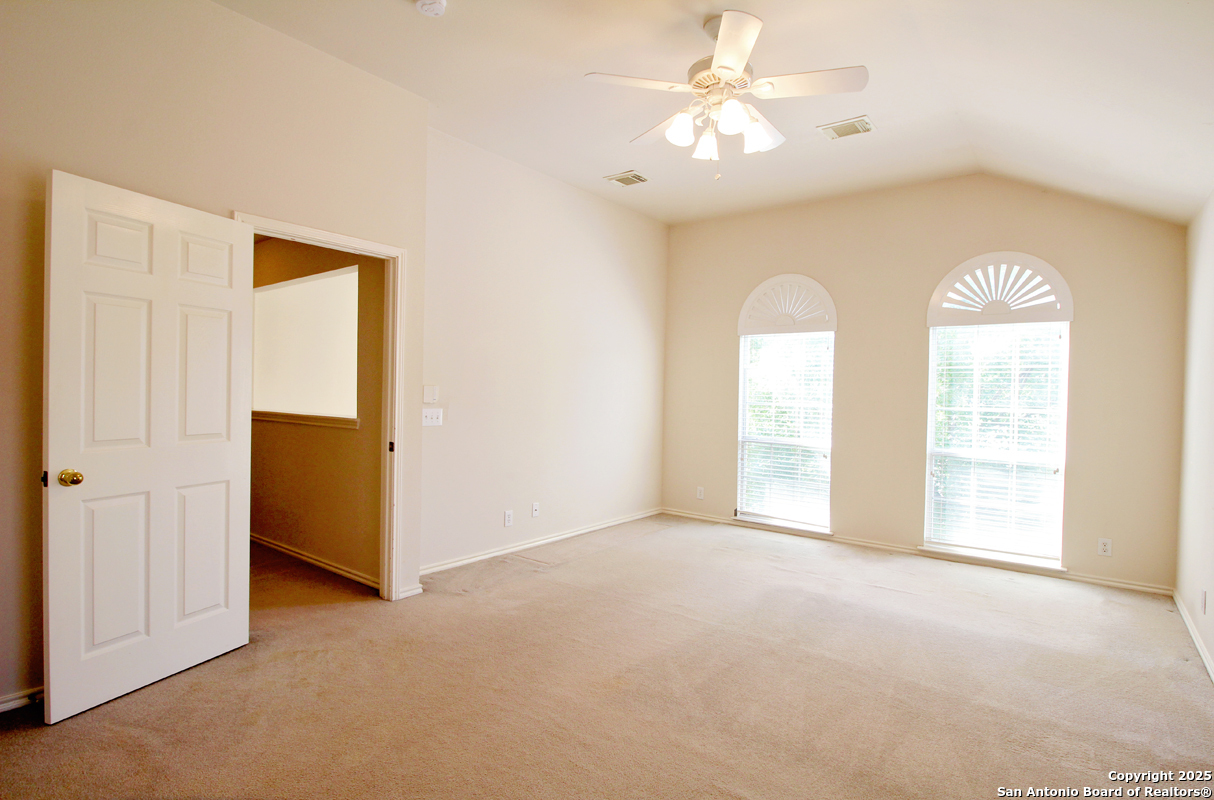 2703 Rio Brazos San Antonio, TX 78259 - Photo 19 of 34 an empty room with windows and fan