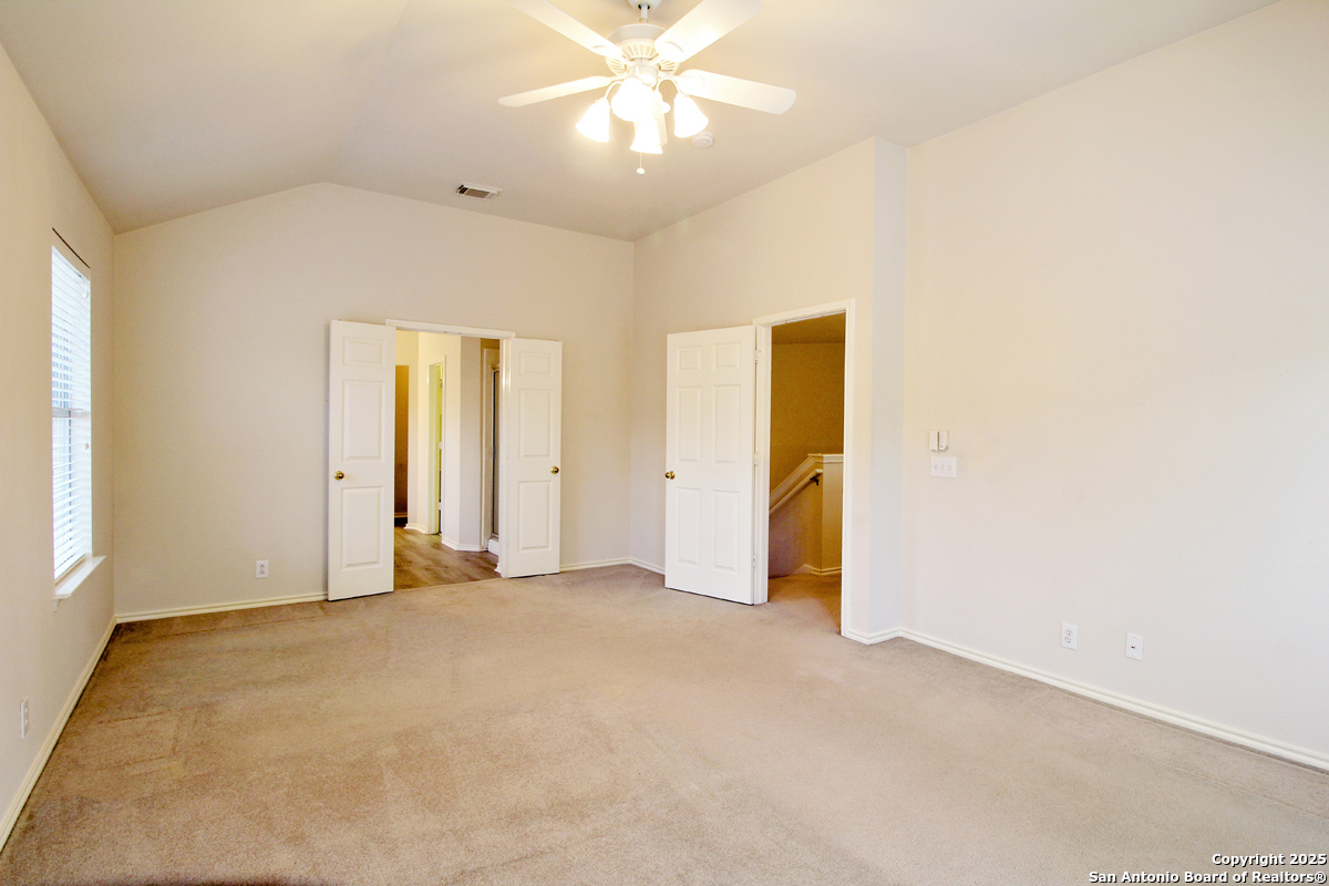2703 Rio Brazos San Antonio, TX 78259 - Photo 20 of 34 an empty room with closet and a chandelier fan