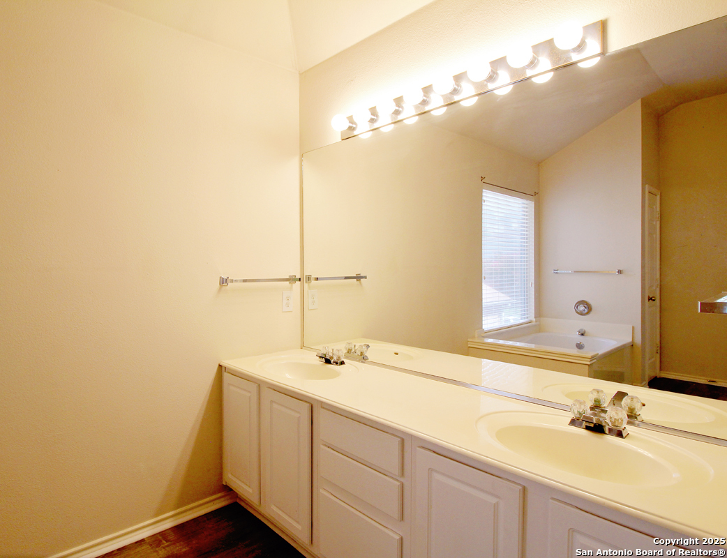 2703 Rio Brazos San Antonio, TX 78259 - Photo 24 of 34 a bathroom with a sink and a mirror