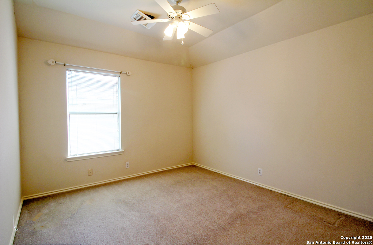2703 Rio Brazos San Antonio, TX 78259 - Photo 28 of 34 an empty room with a window and a fan