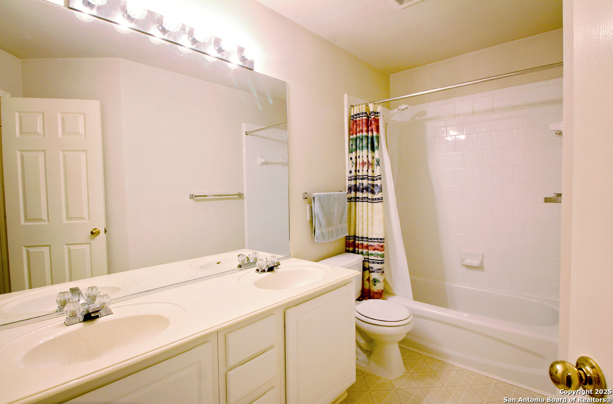 2703 Rio Brazos San Antonio, TX 78259 - Photo 31 of 34 a bathroom with a sink a toilet and shower