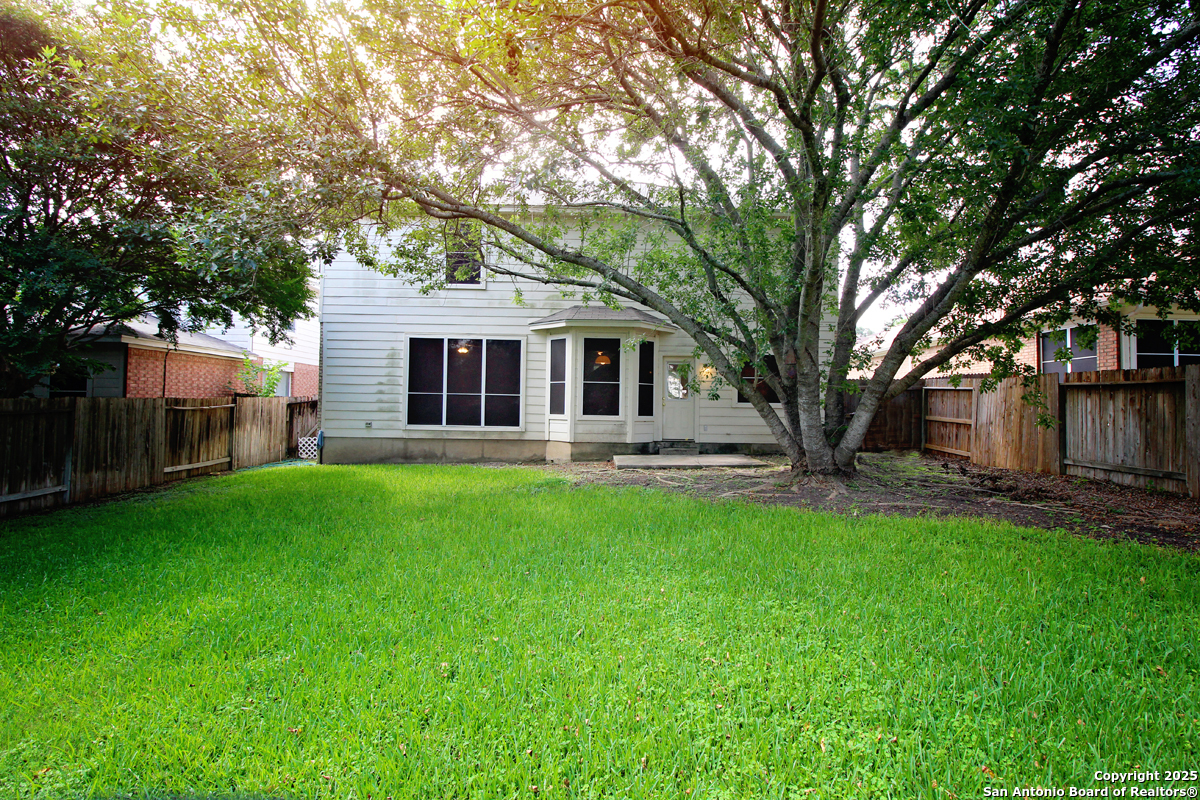 2703 Rio Brazos San Antonio, TX 78259 - Photo 33 of 34 a front view of a house with yard and green space