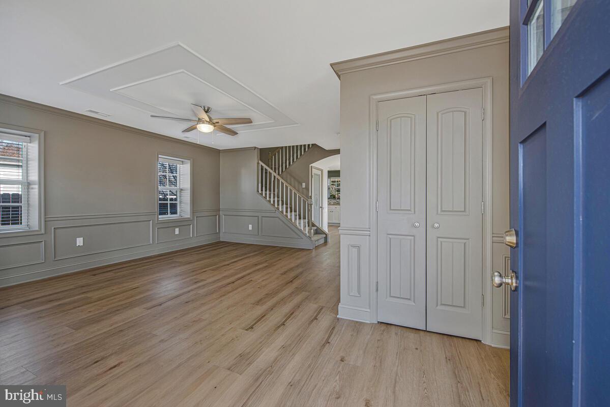 941 8th Street Pasadena, MD 21122 - Photo 5 of 41 a view of empty room with wooden floor and entryway