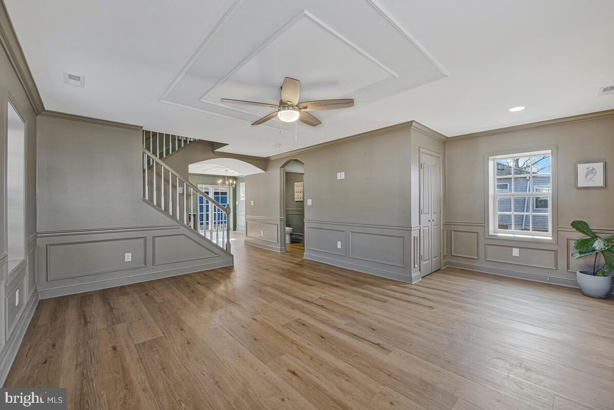 941 8th Street Pasadena, MD 21122 - Photo 6 of 41 wooden floor in an empty room with a window