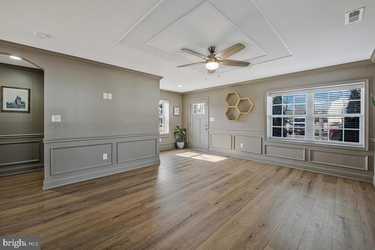 941 8th Street Pasadena, MD 21122 - Photo 7 of 41 wooden floor in an empty room with a window