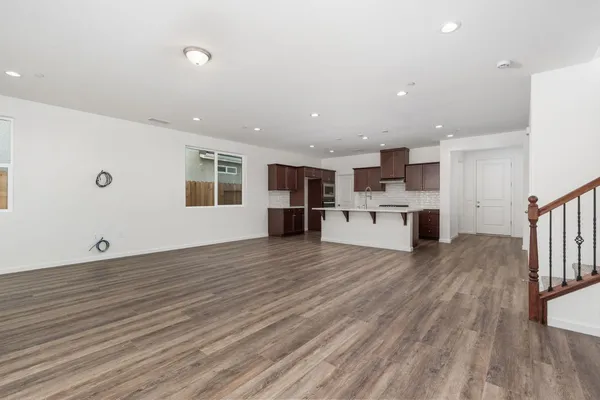 a view of kitchen and wooden floor