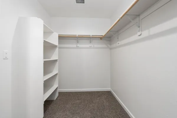 a view of an empty walk in closet