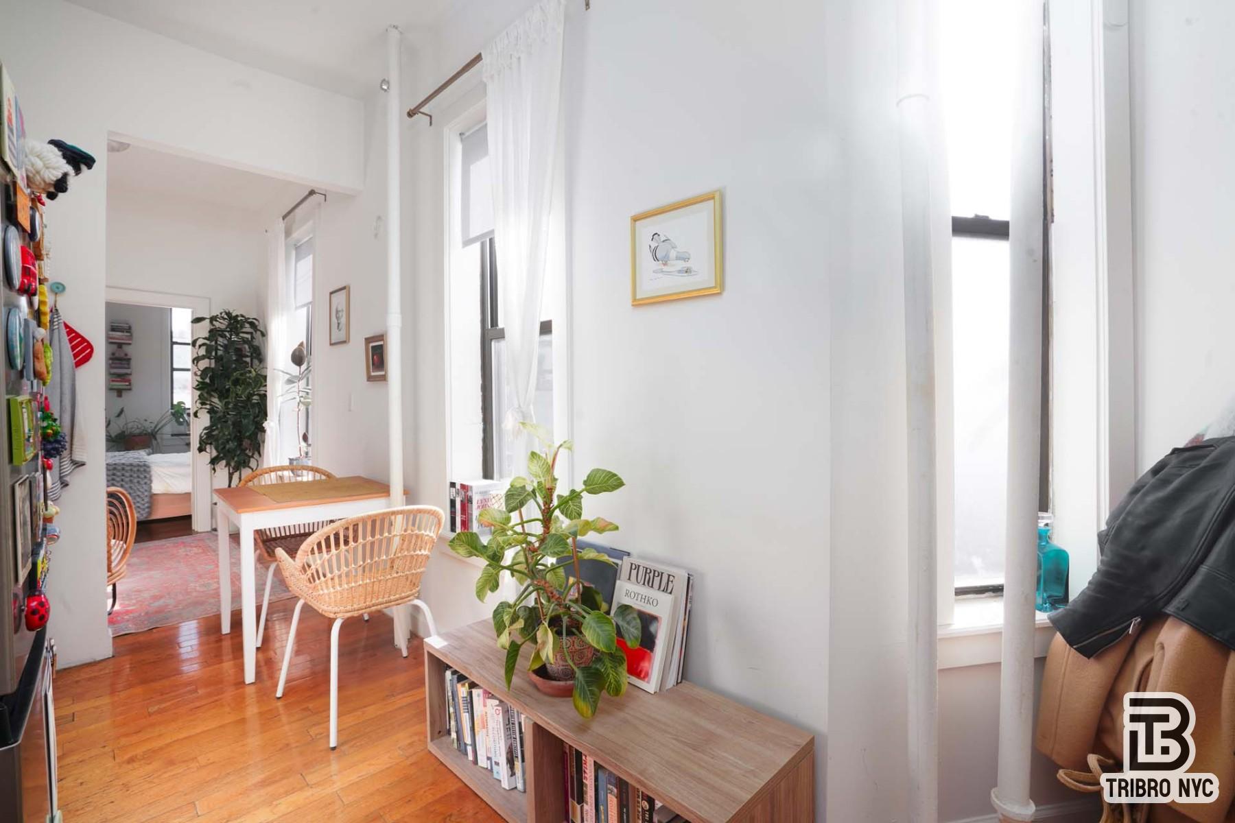 301 West 20th Street, Unit 2A Manhattan, NY 10011 - Photo 5 of 6 a living room with furniture and a potted plant