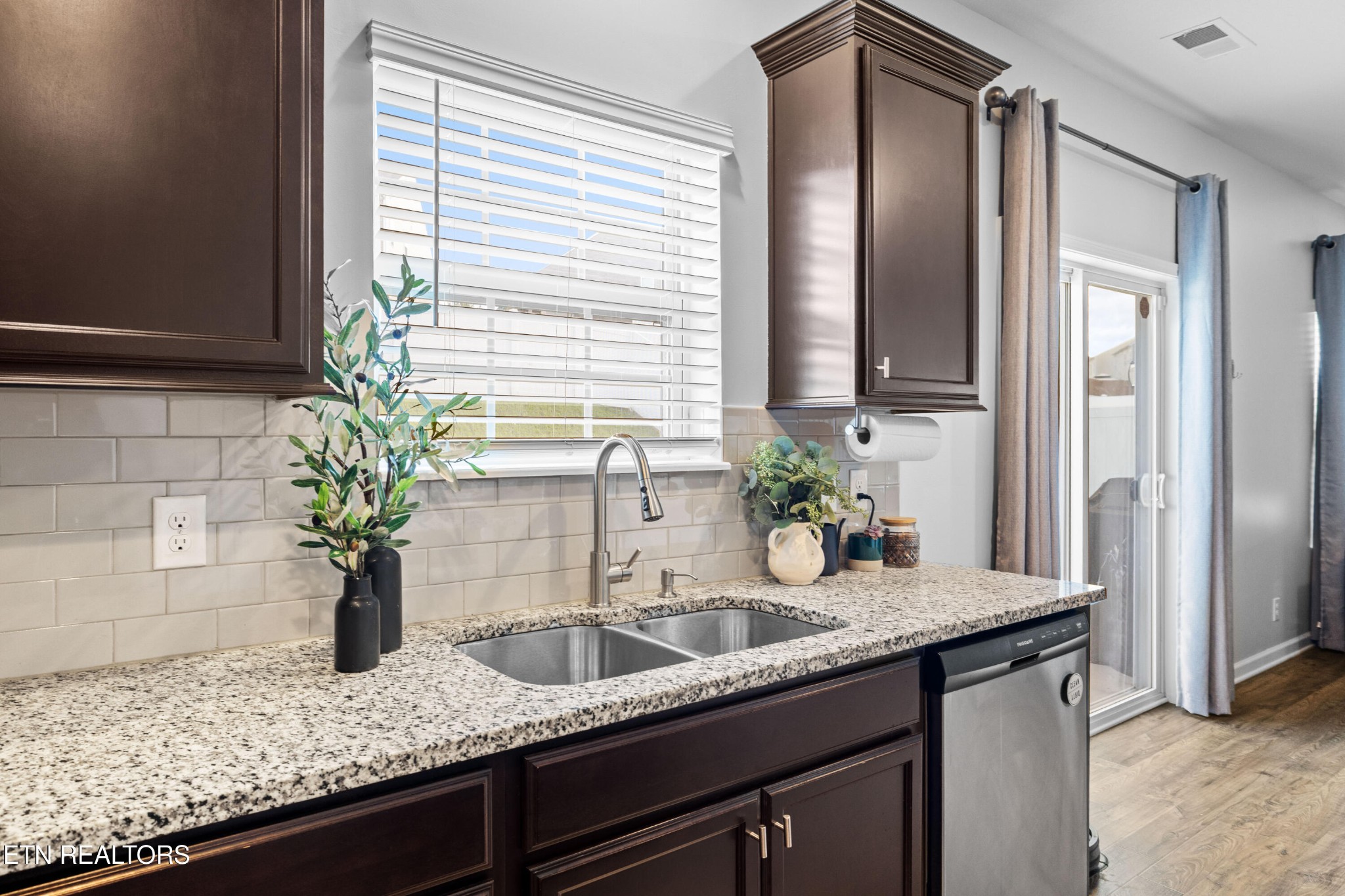 6150 Pembridge Road Knoxville, TN 37912 - Photo 13 of 34 a kitchen with sink and potted plant