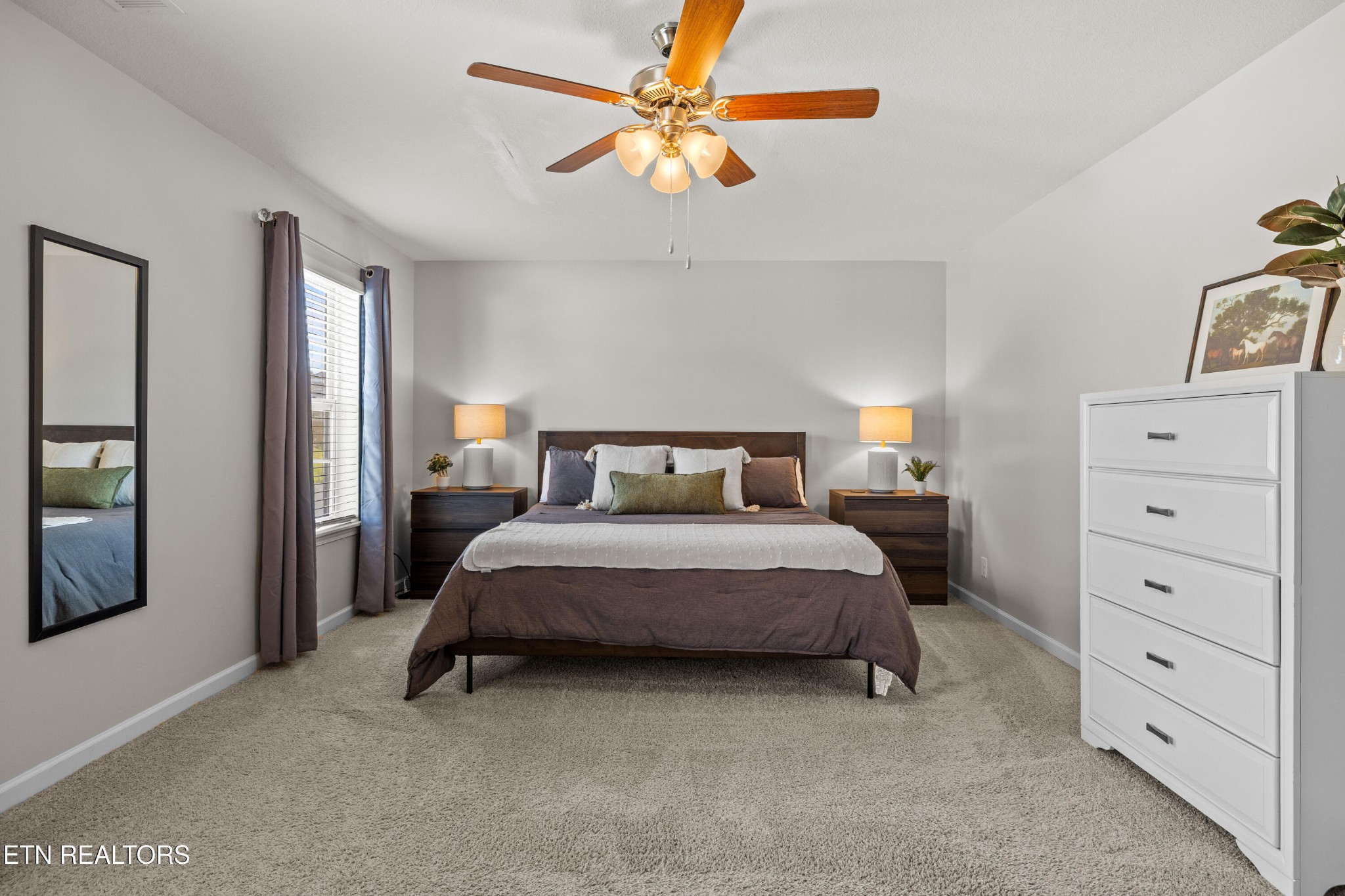 6150 Pembridge Road Knoxville, TN 37912 - Photo 24 of 34 a bedroom with a bed and a chandelier