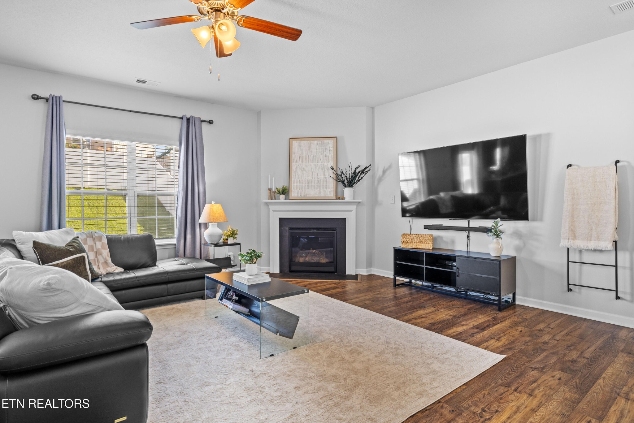 6150 Pembridge Road Knoxville, TN 37912 - Photo 4 of 34 a living room with furniture and a flat screen tv