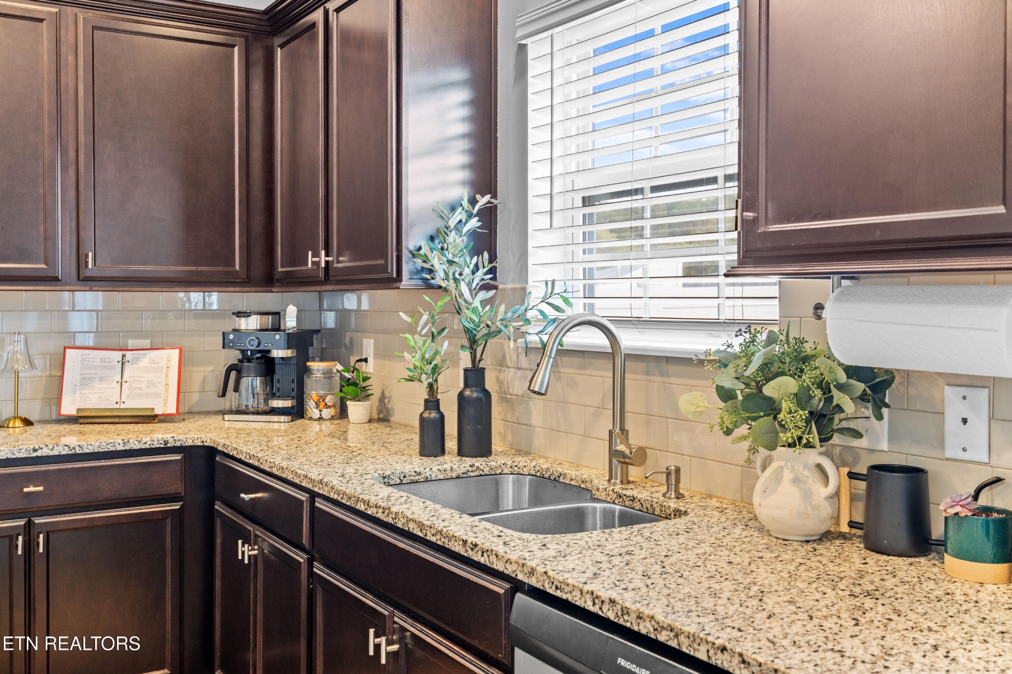 6150 Pembridge Road Knoxville, TN 37912 - Photo 10 of 34 a kitchen with granite countertop a sink and a window