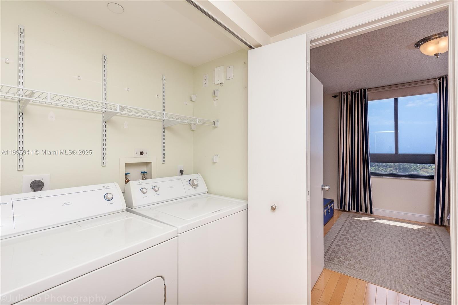1330 West Avenue, Unit 1613 Miami Beach, FL 33139 - Photo 11 of 20 a utility room with dryer and washer