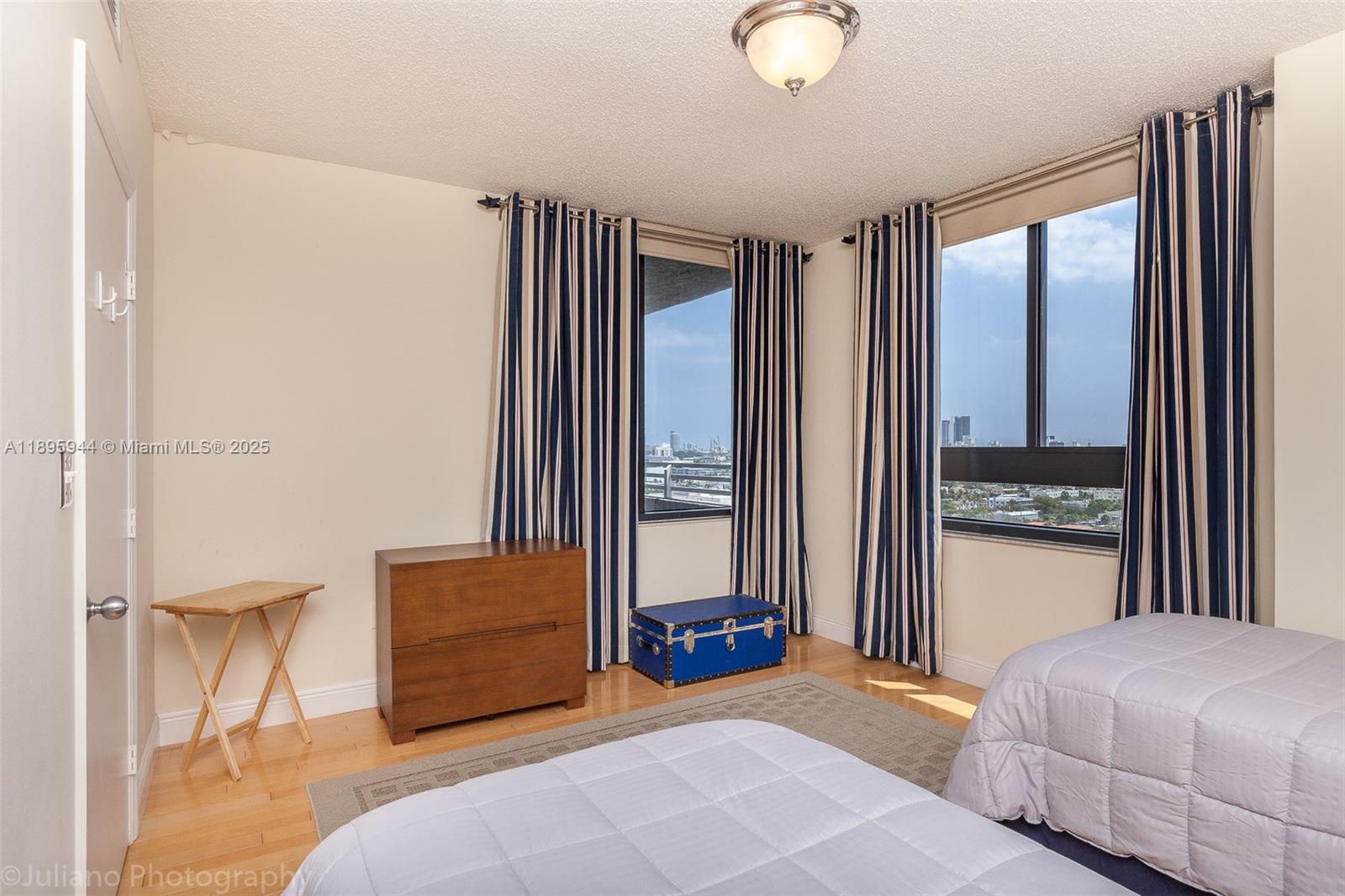 1330 West Avenue, Unit 1613 Miami Beach, FL 33139 - Photo 8 of 20 a bedroom with a bed and a window