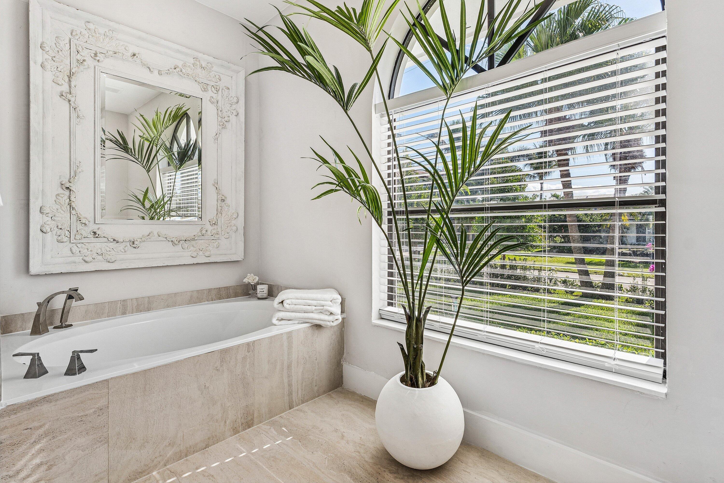48 Harbour Drive North Ocean Ridge, FL 33435 - Photo 11 of 25 a bath tub sitting next to a window