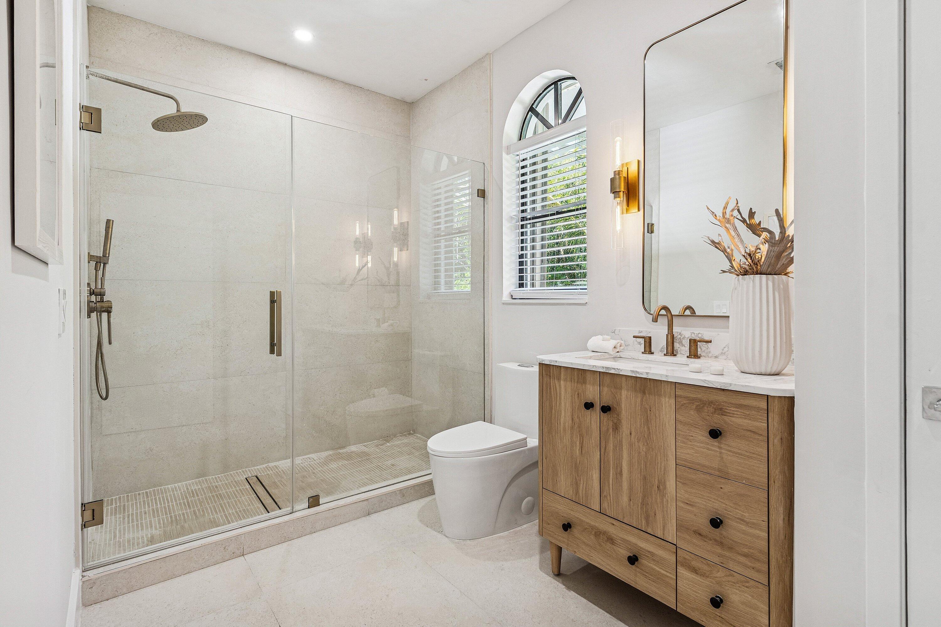 48 Harbour Drive North Ocean Ridge, FL 33435 - Photo 14 of 25 a bathroom with a sink toilet and shower