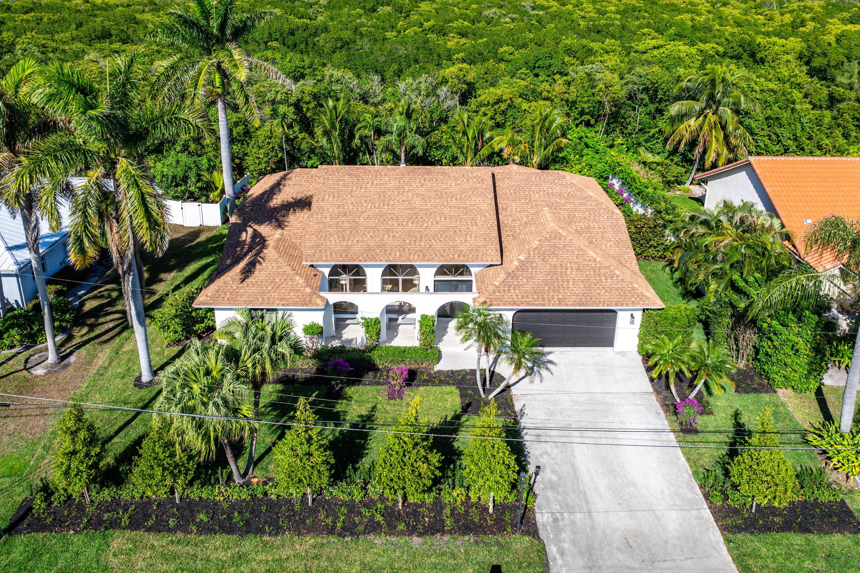 48 Harbour Drive North Ocean Ridge, FL 33435 - Photo 20 of 25 an aerial view of a house with yard swimming pool and outdoor seating