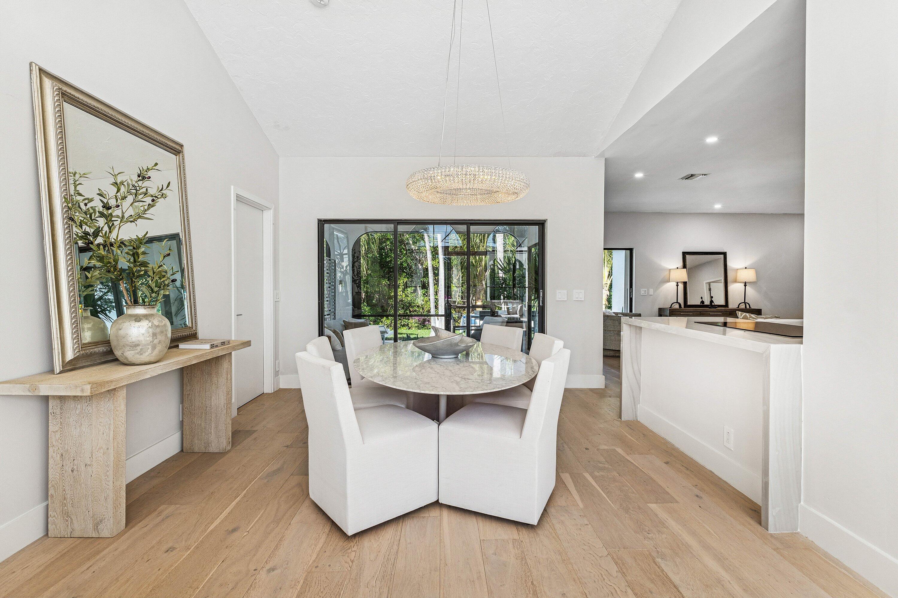 48 Harbour Drive North Ocean Ridge, FL 33435 - Photo 5 of 25 a dining room with furniture and wooden floor