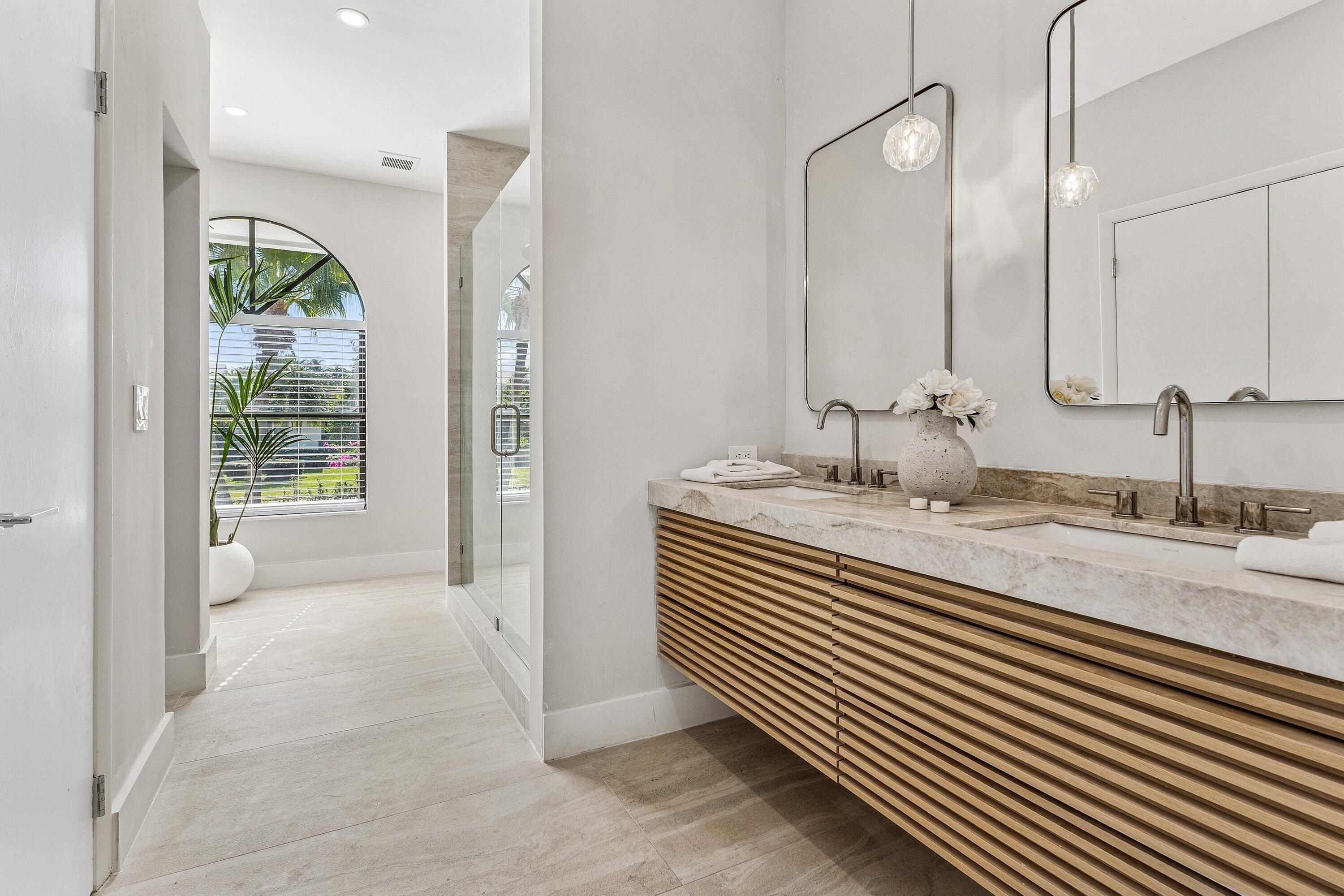 48 Harbour Drive North Ocean Ridge, FL 33435 - Photo 10 of 25 a bathroom with a granite countertop sink and a mirror