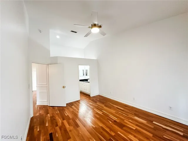 a bathroom with a granite countertop sink a toilet and shower