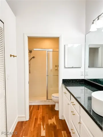 a spacious bathroom with a double vanity sink and a mirror