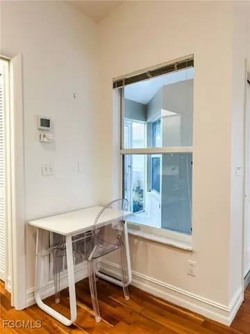 a room with a sink and a mirror