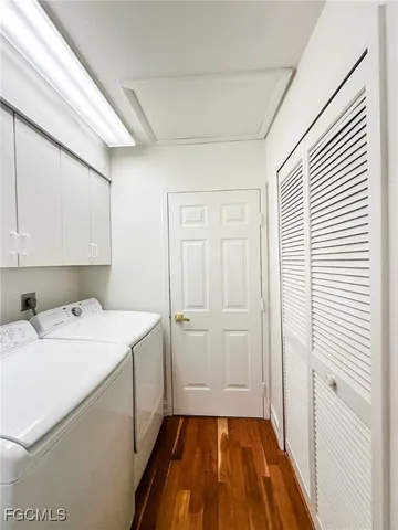 a view of a livingroom with wooden floor and a window