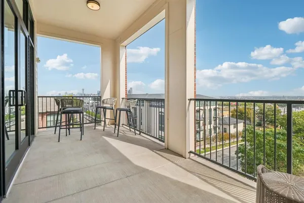 a view of a balcony with chairs