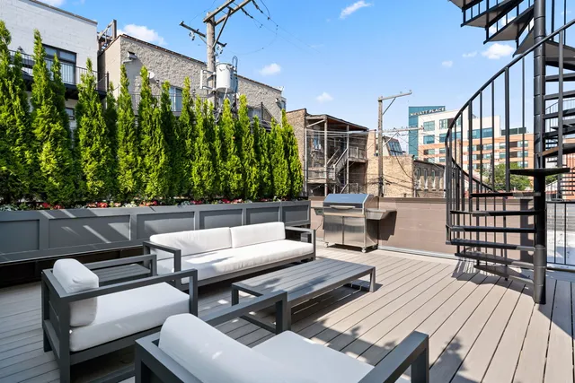 a outdoor living space with furniture and a potted plant