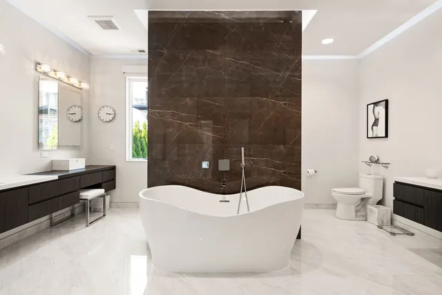 a bathroom with a bathtub and a sink