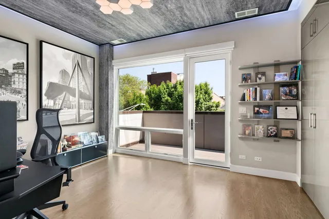a view of a livingroom with furniture and a flat screen tv