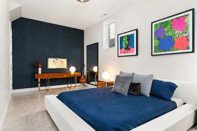 a bed room with a bed and a couch