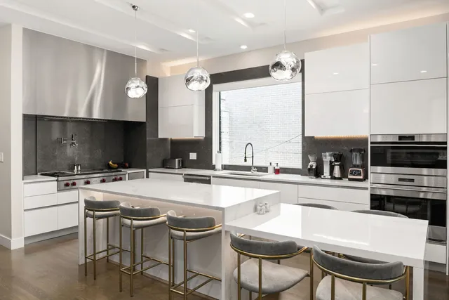 a kitchen with a stove a sink and a refrigerator