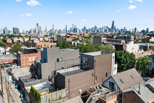 an aerial view of a house with outdoor space