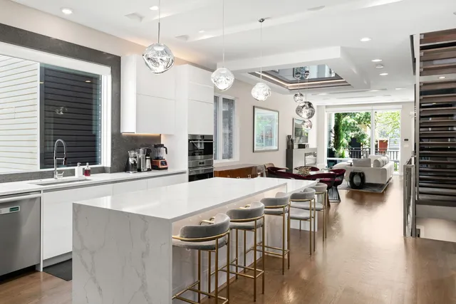 a large kitchen with a table and chairs