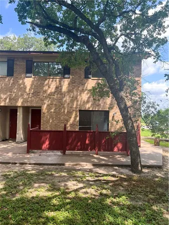 a view of swimming pool with a house in the background