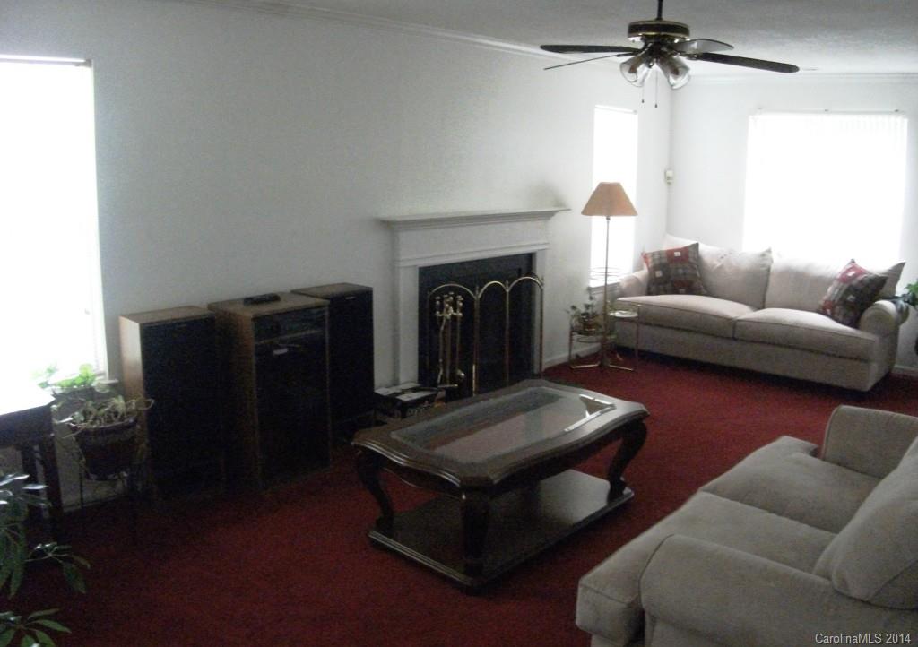 6007 Running Deer Road Charlotte, NC 28214 - Photo 2 of 23 a living room with furniture and a fireplace