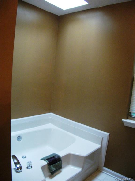 6007 Running Deer Road Charlotte, NC 28214 - Photo 13 of 23 a bathroom with a tub