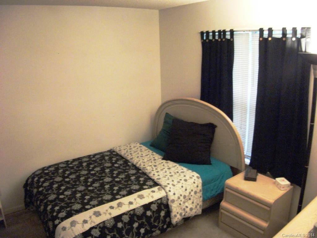6007 Running Deer Road Charlotte, NC 28214 - Photo 15 of 23 a bedroom with a bed and a dresser