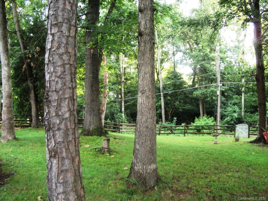6007 Running Deer Road Charlotte, NC 28214 - Photo 19 of 23 a view of outdoor space with a garden and trees