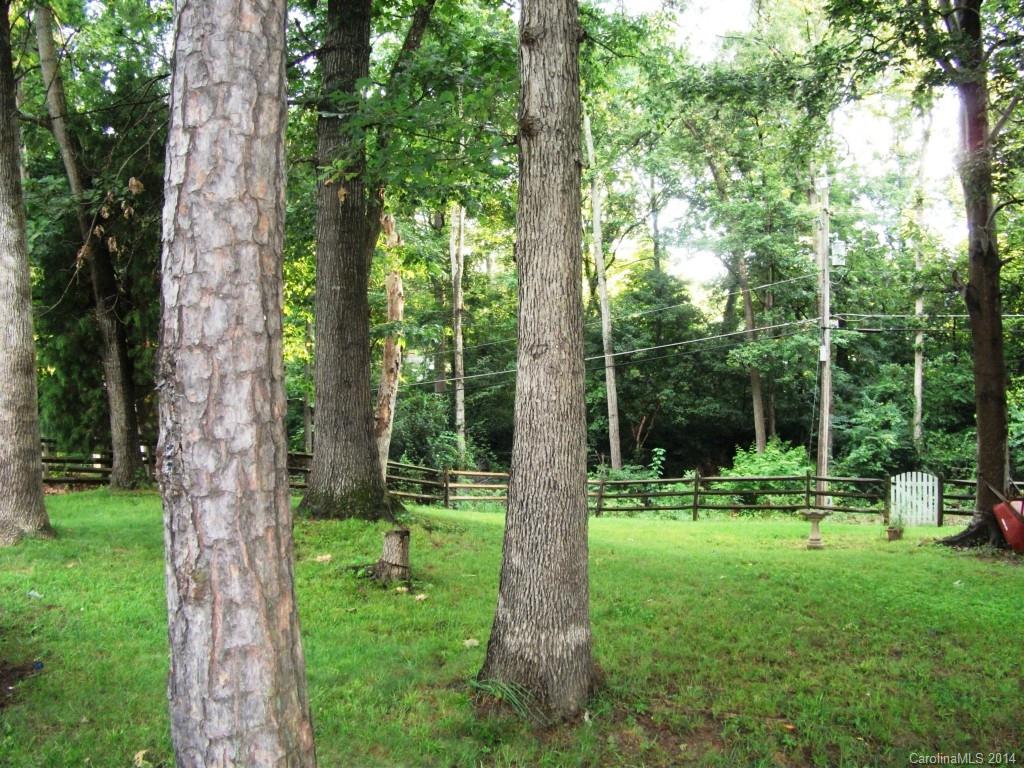 6007 Running Deer Road Charlotte, NC 28214 - Photo 20 of 23 a view of outdoor space with a garden and trees
