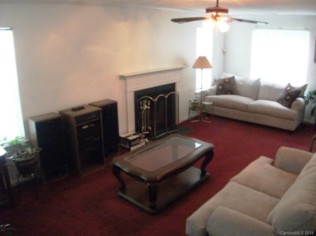 6007 Running Deer Road Charlotte, NC 28214 - Photo 3 of 23 a living room with furniture and a fireplace