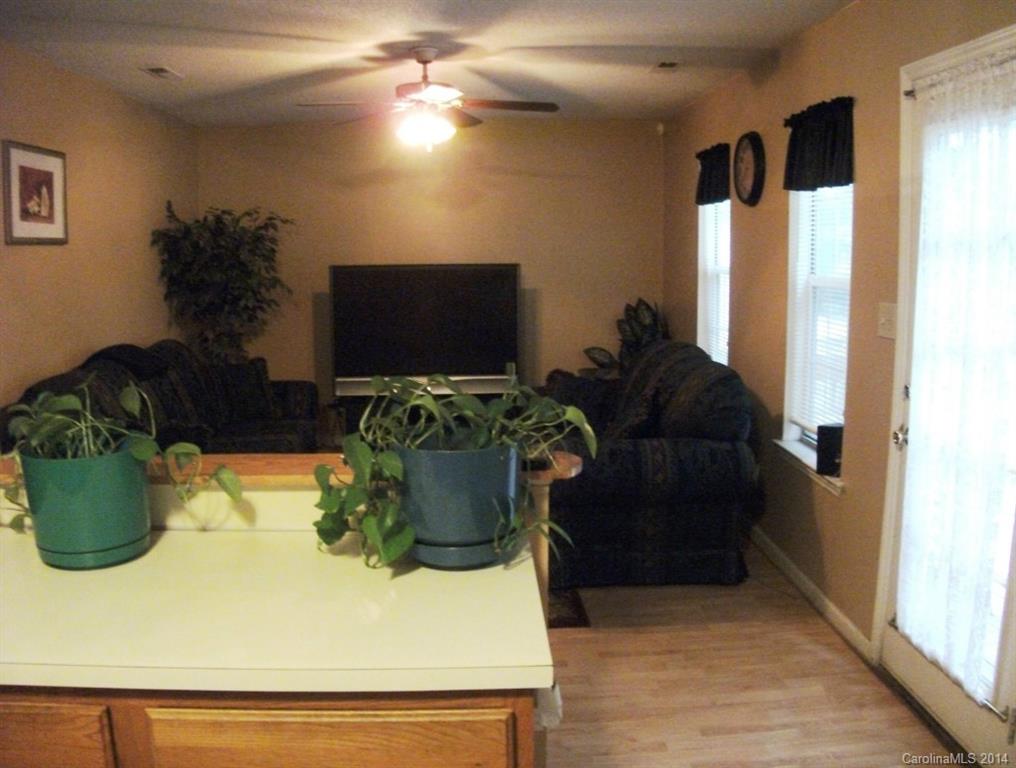 6007 Running Deer Road Charlotte, NC 28214 - Photo 4 of 23 a living room with furniture and a flat screen tv