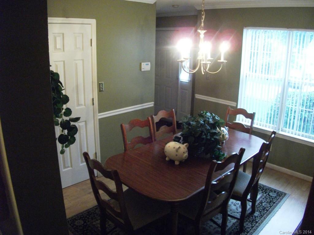6007 Running Deer Road Charlotte, NC 28214 - Photo 8 of 23 a view of a dining room with furniture and window