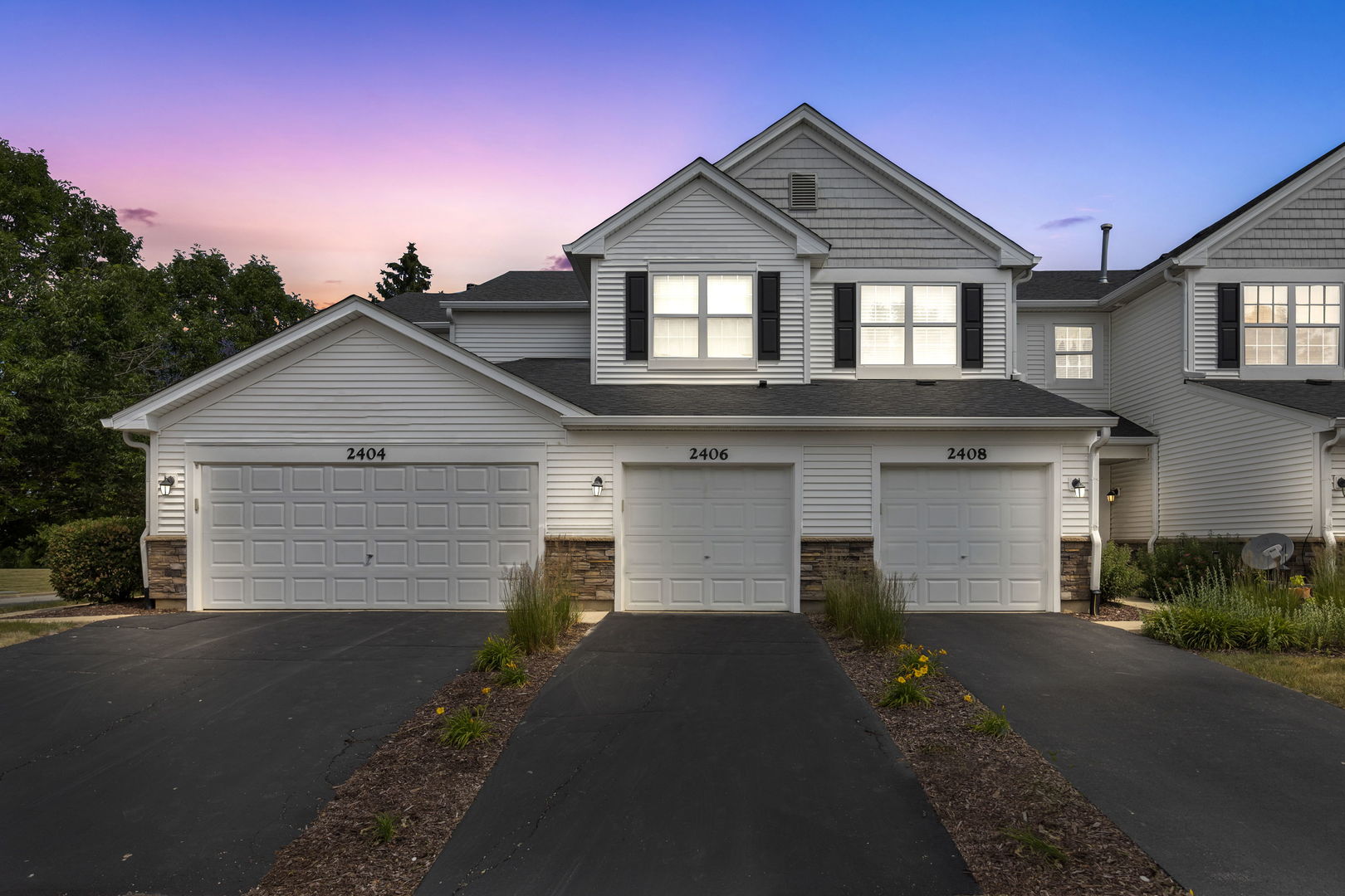2406 Golf Ridge Circle Naperville, IL 60563 - Photo 1 of 22 a front view of a house with a yard and garage