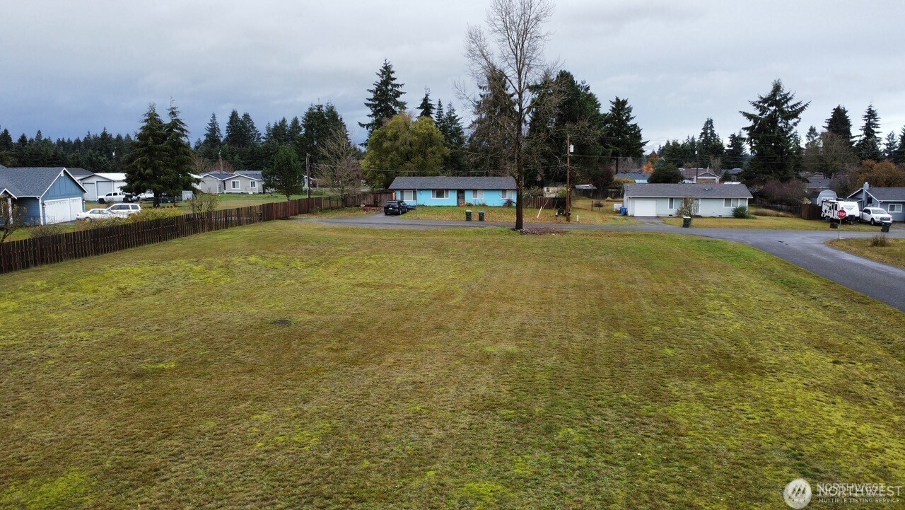 18905 Prairie Street Southwest Rochester, WA 98579 - Photo 2 of 7 a view of a swimming pool and trees in the background