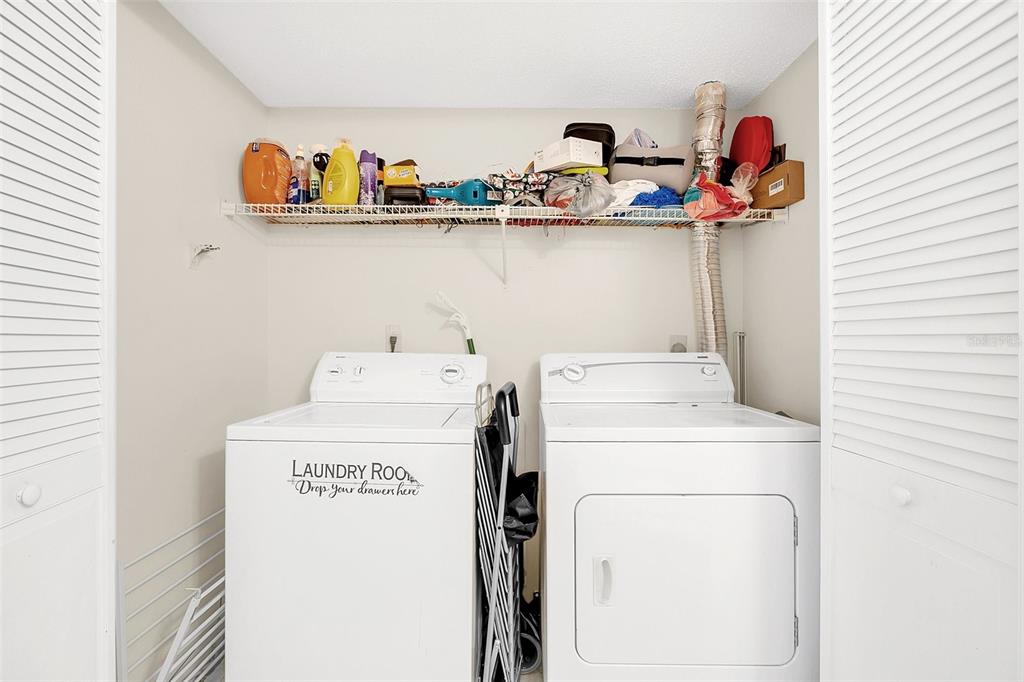 1612 Sandy Point Square, Unit 56 Orlando, FL 32807 - Photo 20 of 26 a utility room with dryer and washer